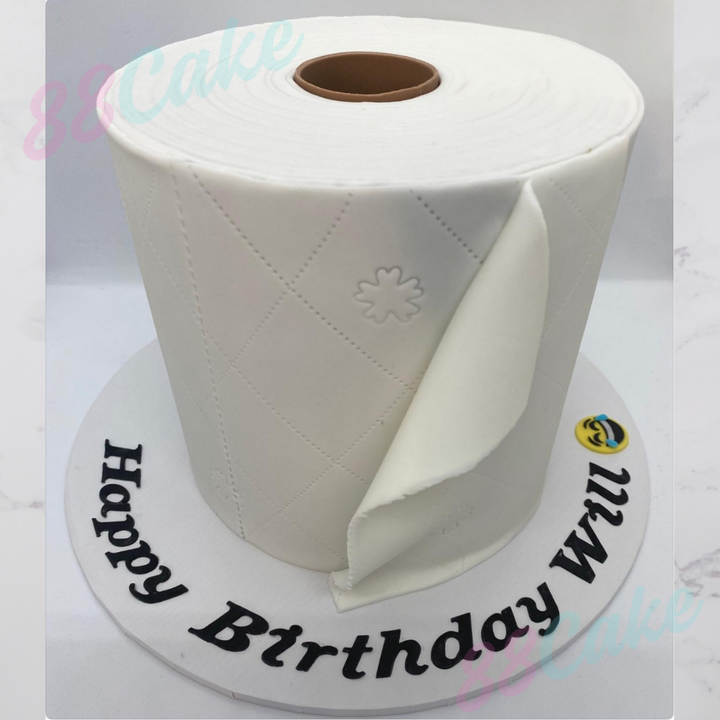 A cake shaped like a toilet roll