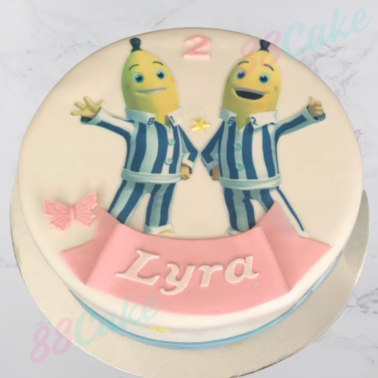 Bananas in pajamas cake and a pink banner with 'Lyra' on a white background.