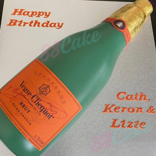 Bottle-shaped cake with Veuve Clicquot label and 'Happy Birthday' 