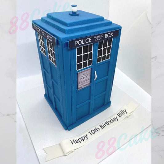 Blue Doctor Who TARDIS-shaped cake with a birthday message