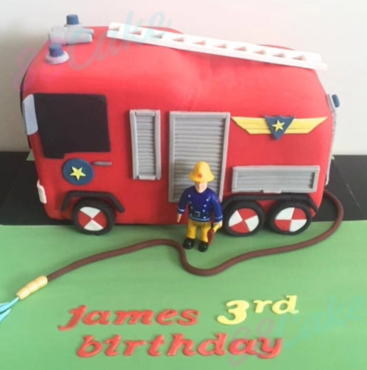Red fire truck cake with a toy firefighter with 'James 3rd birthday'