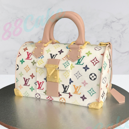 Louis Vuitton handbag shaped cake with multicolor monogram pattern