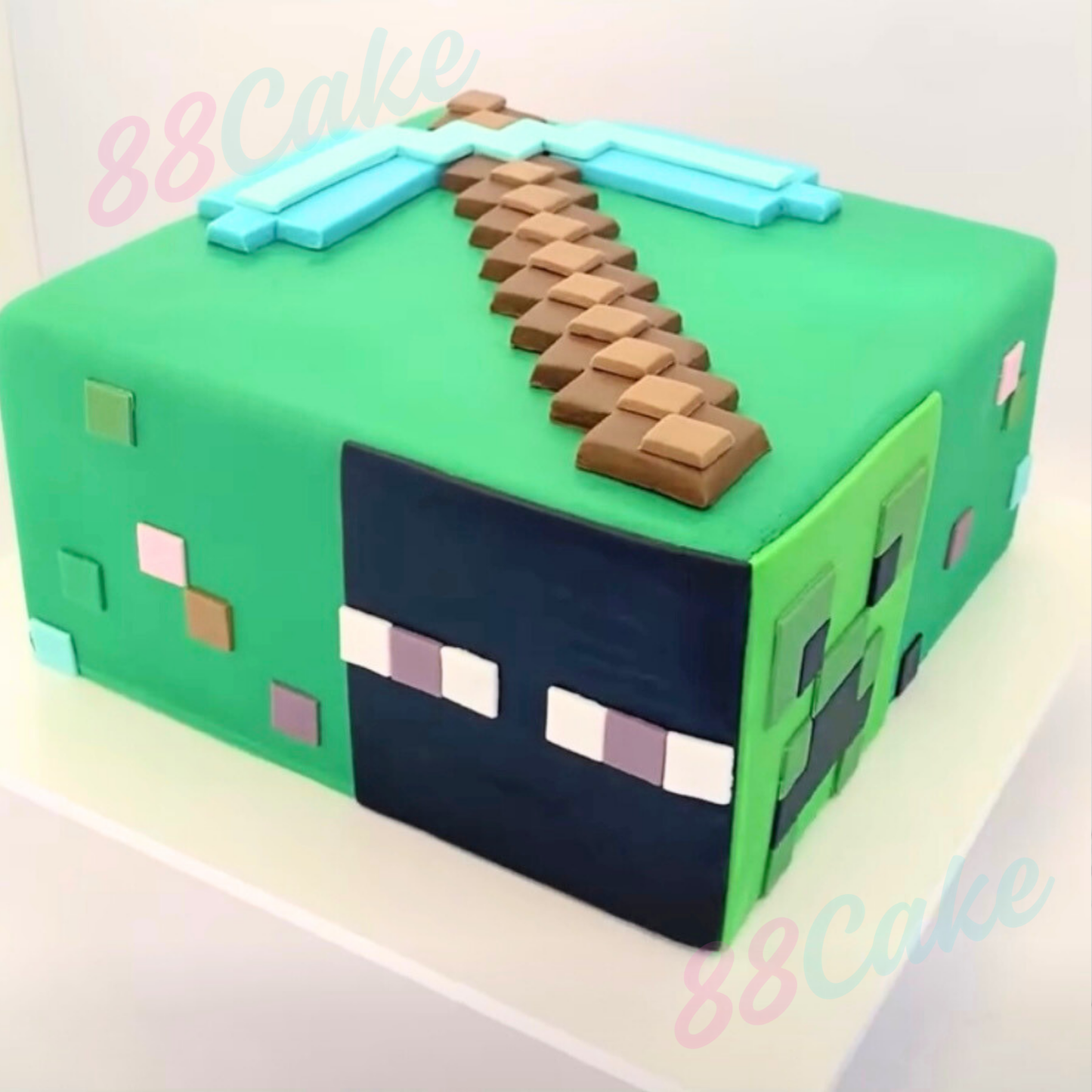 Square Minecraft cake with enderman and creeper with a diamond pick axe