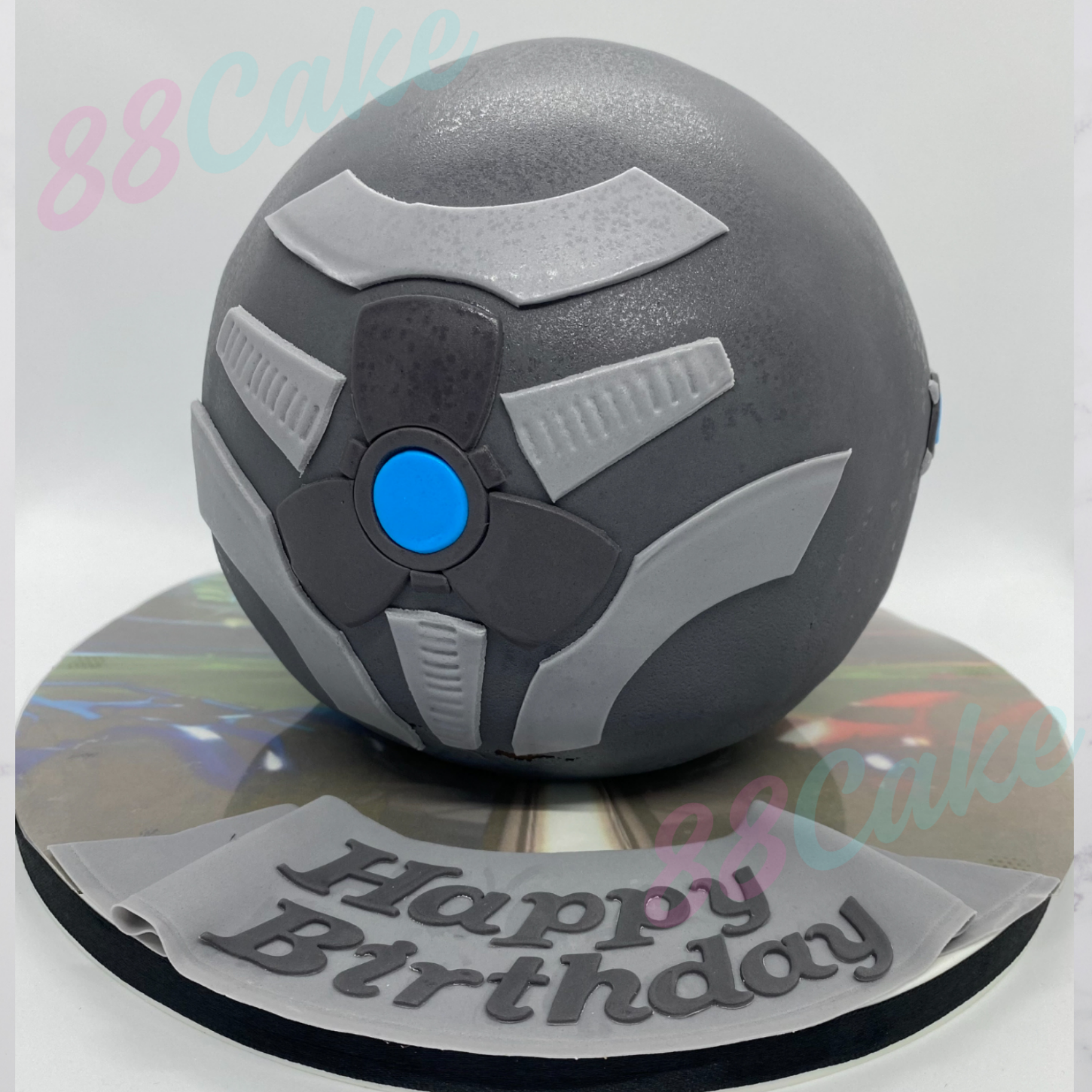 Round ball shaped cake with 'Happy Birthday’