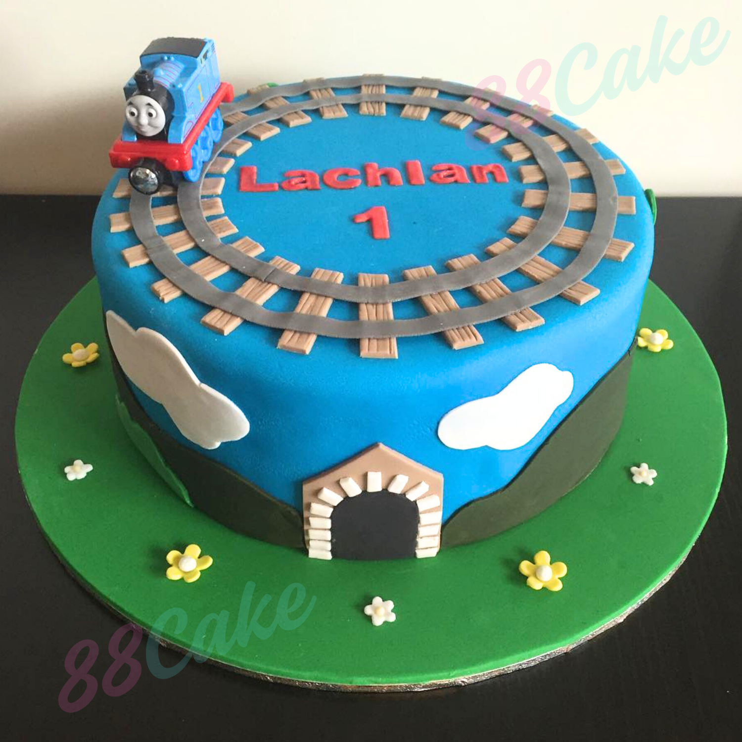 Toddler birthday cake with train theme 