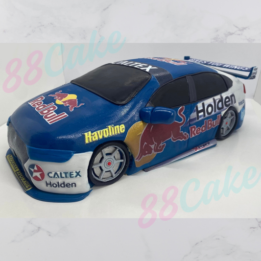 V8 Supercar car-shaped cake with Red Bull and Holden branding